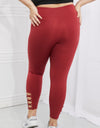 Yelete Ready For Action Full Size Ankle Cutout Active Leggings in Brick Red