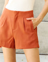 And The Why Every Little Thing Full Size Pleated High Waisted Shorts in Ochre