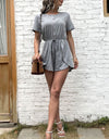 Perfee Buttoned Drawstring Round Neck Romper