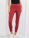 Yelete Ready For Action Full Size Ankle Cutout Active Leggings in Brick Red