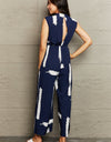 Perfee Printed Round Neck Cutout Jumpsuit with Pockets