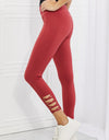 Yelete Ready For Action Full Size Ankle Cutout Active Leggings in Brick Red