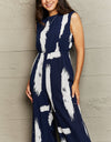 Perfee Printed Round Neck Cutout Jumpsuit with Pockets